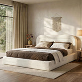The white upholstered bed frame adds a clean, elegant look while creating a cozy focal point for bedrooms and apartments.