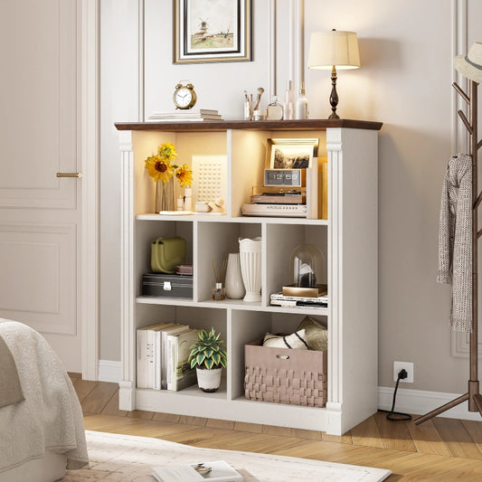 Storage in white cabinets includes books, potted plants, and other miscellaneous items 800