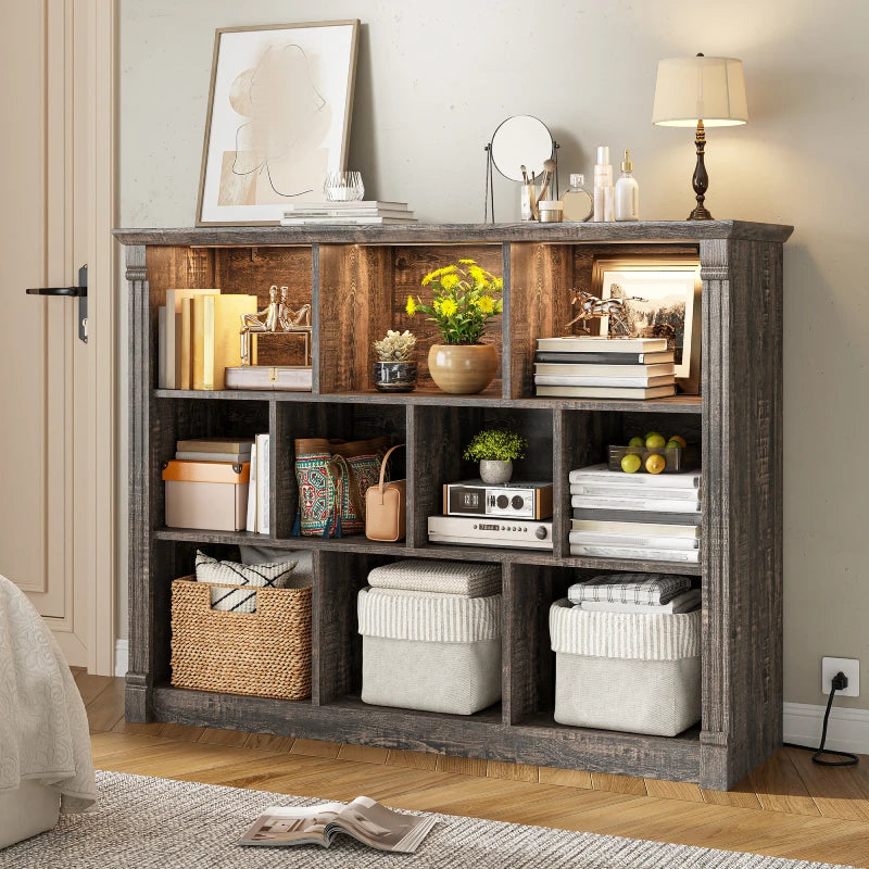 Storage in white cabinets includes books, potted plants, and other miscellaneous items