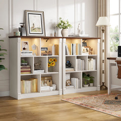 In the center of the living room stands a white storage cabinet, with a television hanging directly above it. The cabinet is uniformly white, with a smooth surface as reflective as a mirror, which reflects the soft sunlight streaming in from the window, casting faint shadows on the floor.